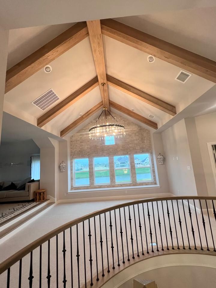 Vaulted ceiling with stained wood beams